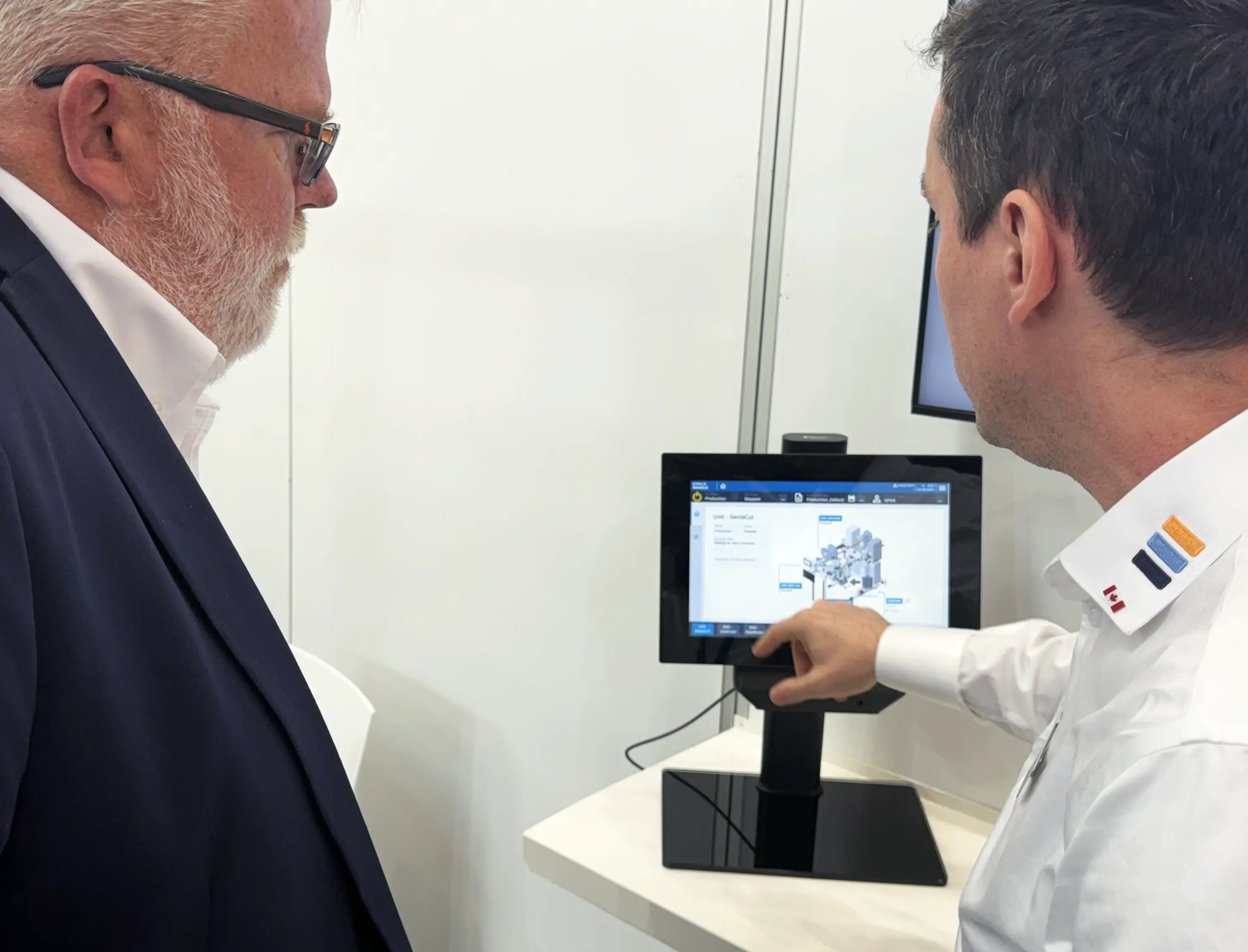 Mathieu Tremblay shows a visitor the new automation app demo